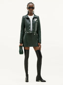 COURRÈGES REEDITION VINYL SKIRT VERT FONCE