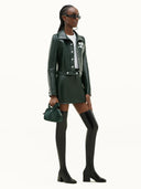 COURRÈGES REEDITION VINYL SKIRT VERT FONCE