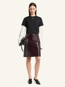 COURRÈGES VINYL KNEE-LENGTH SKIRT BURNT RED