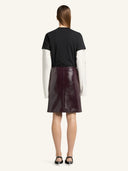 COURRÈGES VINYL KNEE-LENGTH SKIRT BURNT RED